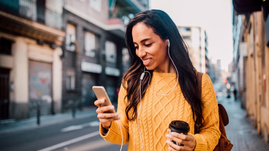woman smiling, looking at her flexible spending plan on YNAB