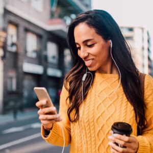 woman smiling, looking at her flexible spending plan on YNAB